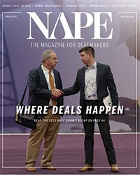 Photo of two men shaking hands on the trade show floor at NAPE Summit.